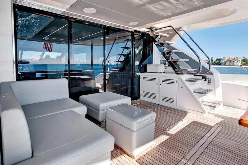 Slide: The Image of Luxurious 2024 Sunseeker 76 Yacht deck with modern seating and ocean view. - 15