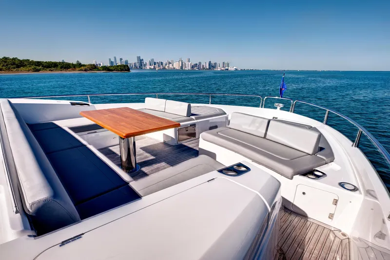 Slide: The Image of Luxurious 2024 Sunseeker 76 Yacht deck with city skyline view. - 19