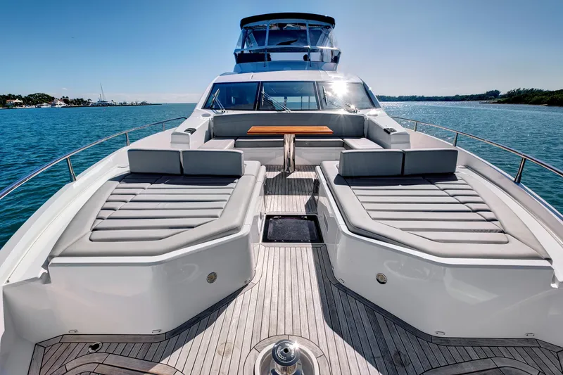 Slide: The Image of Luxurious 2024 Sunseeker 76 Yacht with spacious deck and seating, cruising on serene waters. - 20