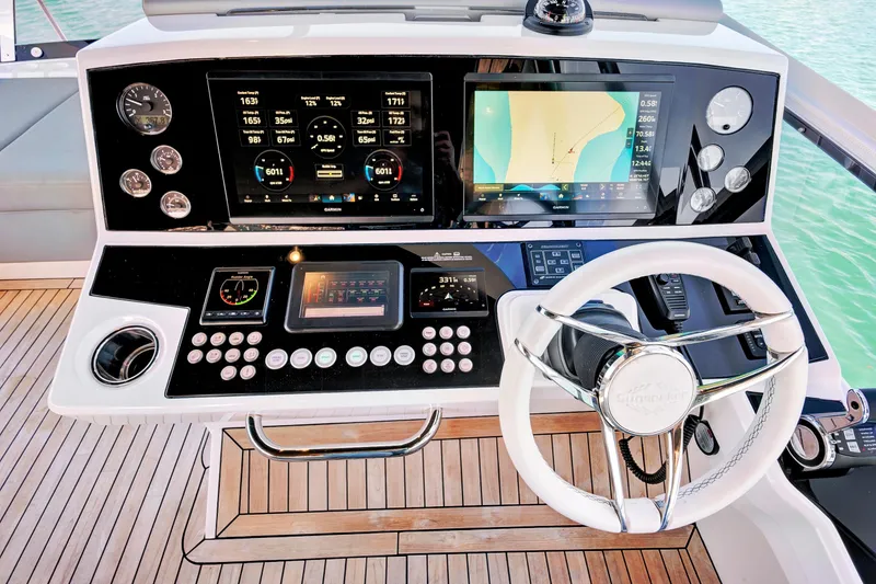 Slide: The Image of 2024 Sunseeker 76 Yacht helm with advanced navigation and control systems. - 30