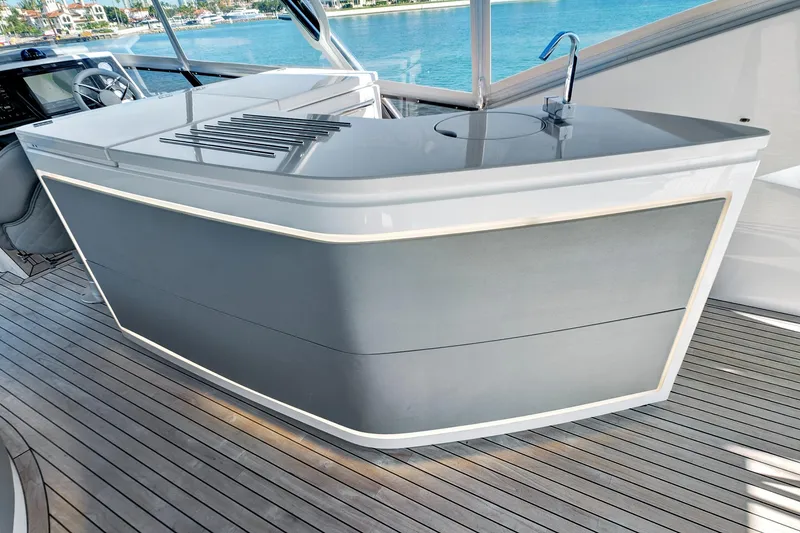 Slide: The Image of Luxurious 2024 Sunseeker 76 Yacht deck with sleek bar and modern design. - 35