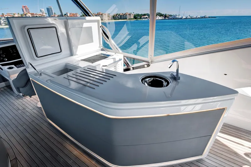 Slide: The Image of Luxurious 2024 Sunseeker 76 Yacht deck with modern outdoor kitchen and stunning ocean view. - 36