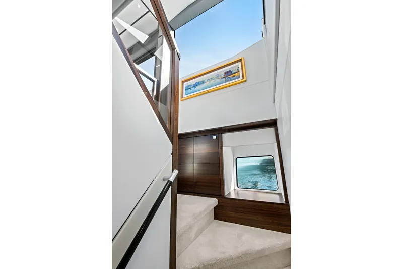 Slide: The Image of Interior staircase of 2024 Sunseeker 76 Yacht with modern design and ocean view. - 45