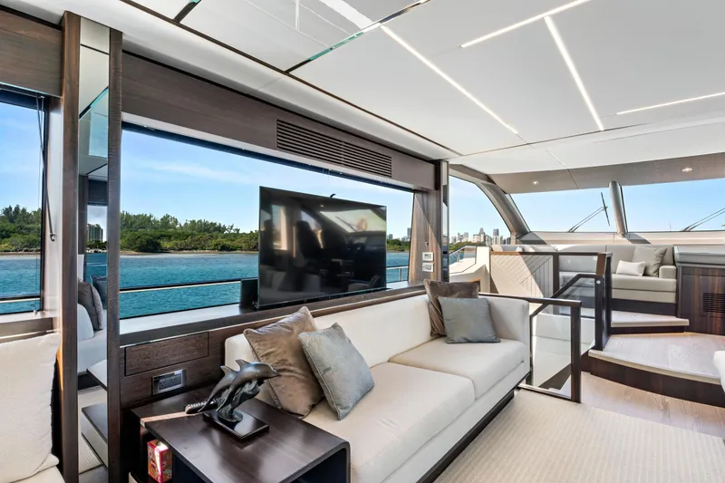 Slide: The Image of Luxurious interior of 2024 Sunseeker 76 Yacht with modern furnishings and scenic water view. - 48