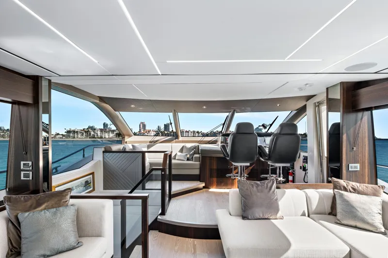 Slide: The Image of Luxurious interior of 2024 Sunseeker 76 Yacht with modern helm and plush seating. - 51