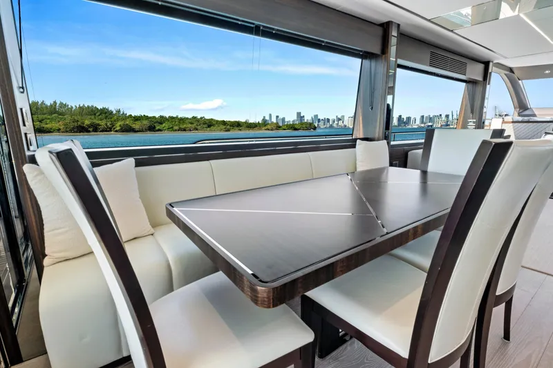 Slide: The Image of Luxurious interior of 2024 Sunseeker 76 Yacht with elegant dining area and scenic ocean view. - 56