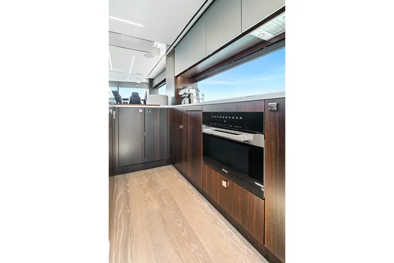 Slide: The Image of Luxurious kitchen interior of 2024 Sunseeker 76 Yacht with modern appliances and sleek cabinetry. - 58