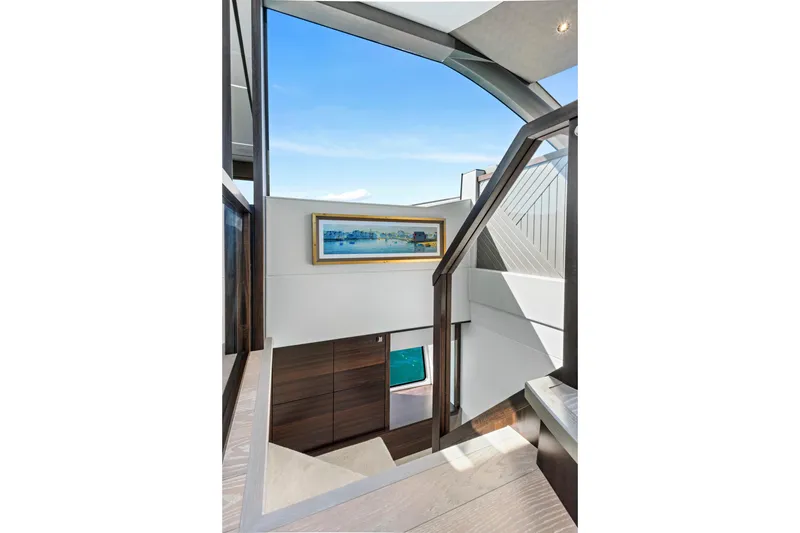 Slide: The Image of Interior staircase of 2024 Sunseeker 76 Yacht with modern design and artwork. - 62