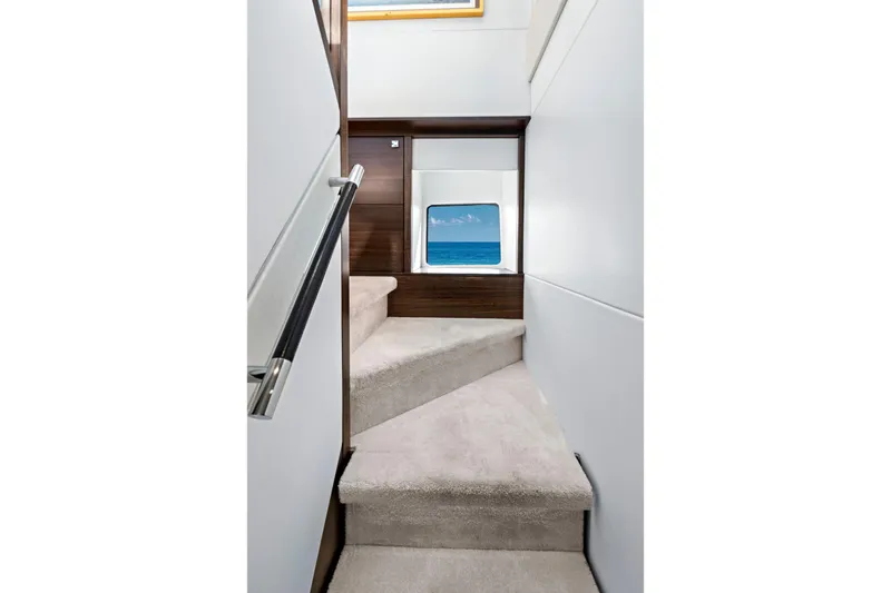 Slide: The Image of Interior staircase of 2024 Sunseeker 76 Yacht with ocean view window. - 63