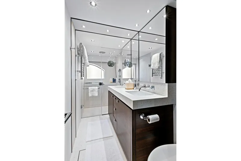 Slide: The Image of Luxurious bathroom in 2024 Sunseeker 76 Yacht, featuring modern fixtures and elegant design. - 70