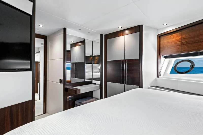 Slide: The Image of Luxurious interior of 2024 Sunseeker 76 Yacht bedroom with modern design and ocean view. - 72