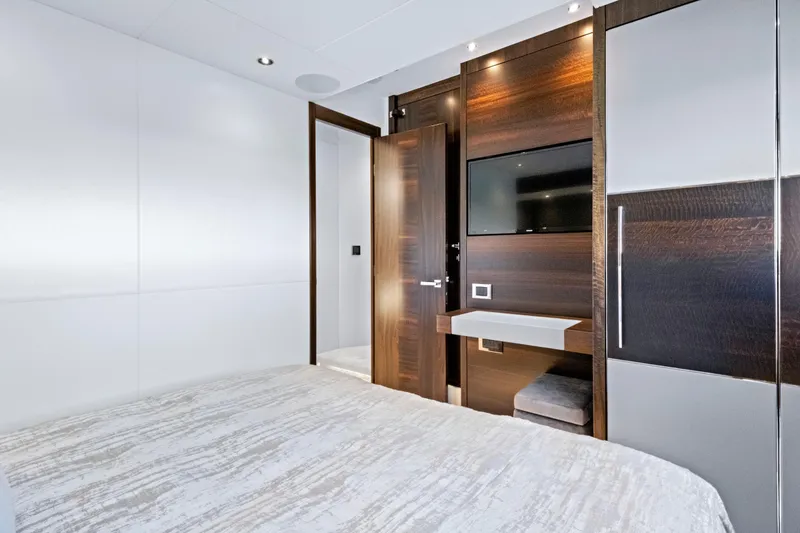 Slide: The Image of Luxurious interior of 2024 Sunseeker 76 Yacht bedroom with modern design and TV. - 82