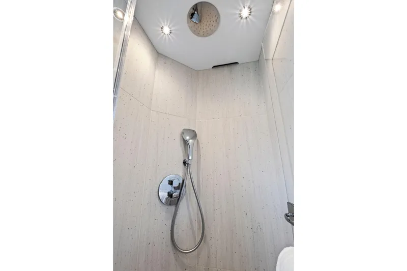 Slide: The Image of Modern shower in 2024 Sunseeker 76 Yacht, featuring sleek design and chrome fixtures. - 86