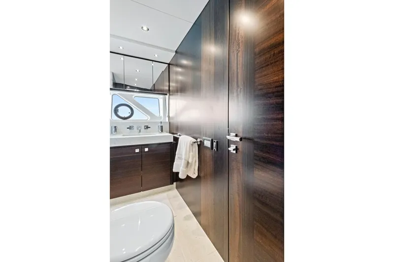 Slide: The Image of Luxurious bathroom interior of 2024 Sunseeker 76 Yacht with sleek wood finishes. - 90