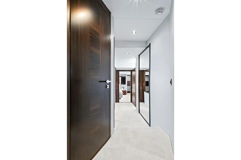 Slide: The Image of Luxurious interior hallway of 2024 Sunseeker 76 Yacht with modern design elements. - 91