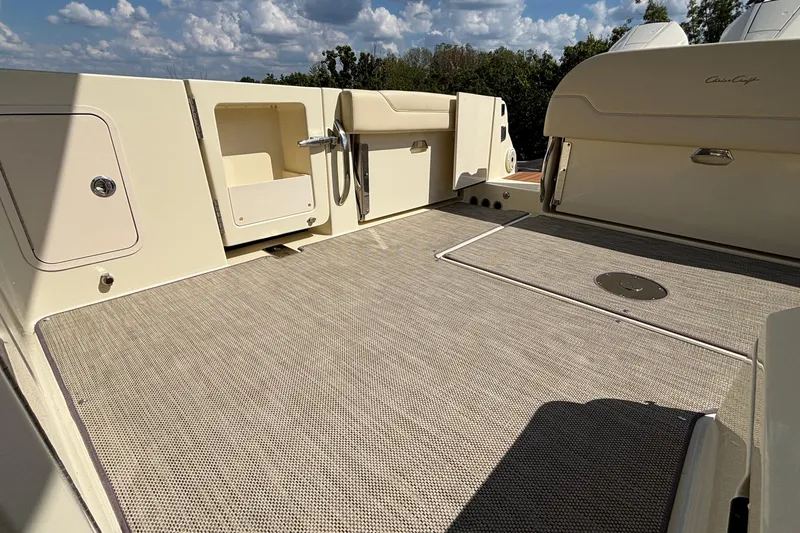 Slide: The Image of 2021 Chris-Craft Calypso 35 boat deck with storage compartments and clean design. - 13