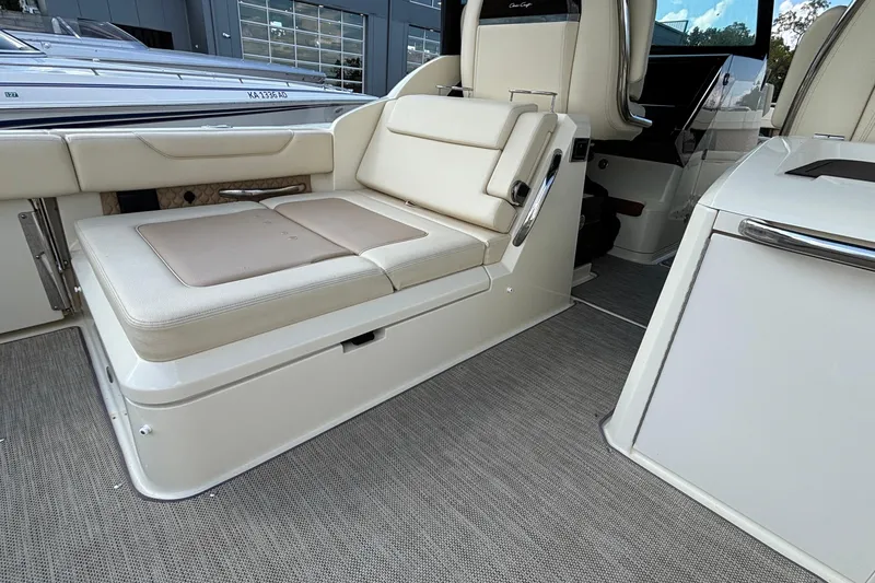 Slide: The Image of 2021 Chris-Craft Calypso 35 interior with beige seating and modern design. - 23