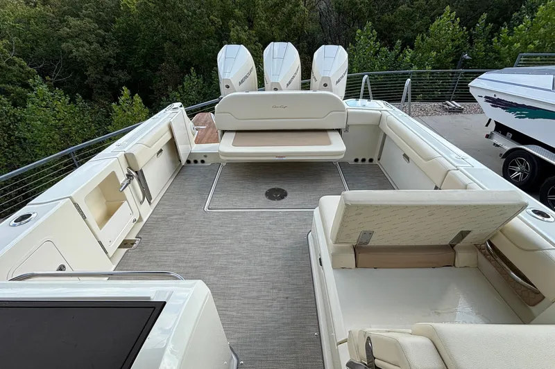 Slide: The Image of 2021 Chris-Craft Calypso 35 boat interior with seating and outboard motors. - 26