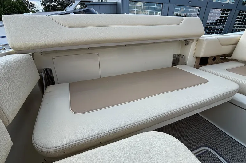 Slide: The Image of 2021 Chris-Craft Calypso 35 boat interior seating with beige and cream upholstery. - 27