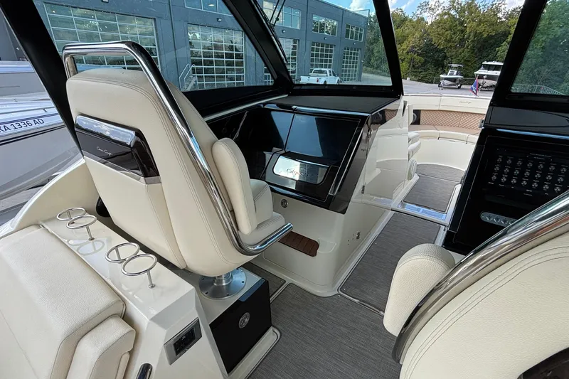 Slide: The Image of 2021 Chris-Craft Calypso 35 boat interior with luxurious seating and modern dashboard. - 30