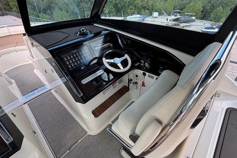 Slide: The Image of 2021 Chris-Craft Calypso 35 helm with modern controls and comfortable seating. - 31