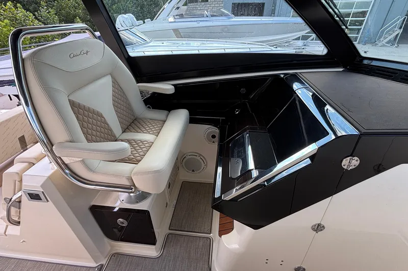 Slide: The Image of 2021 Chris-Craft Calypso 35 helm with luxurious seating and sleek dashboard design. - 32