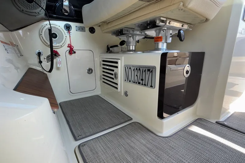 Slide: The Image of 2021 Chris-Craft Calypso 35 interior with seating, storage, and USCG documentation number. - 45