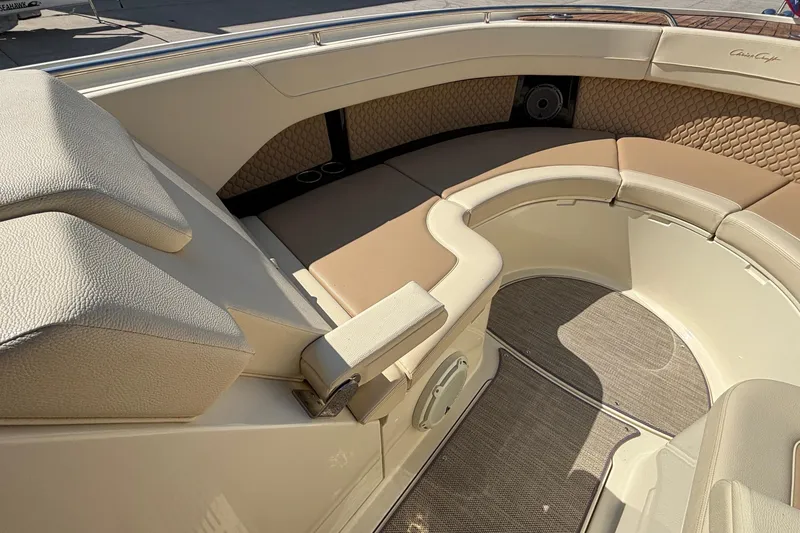 Slide: The Image of Luxurious seating area on a 2021 Chris-Craft Calypso 35 boat, featuring elegant upholstery. - 54