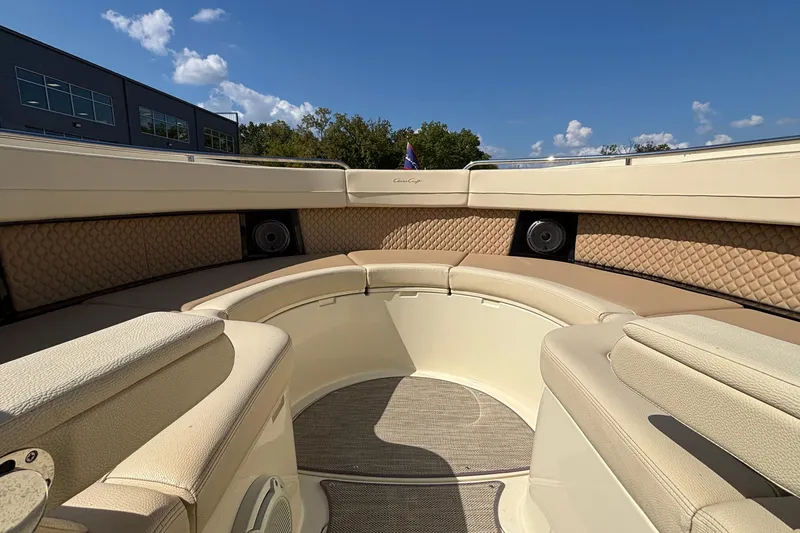 Slide: The Image of 2021 Chris-Craft Calypso 35 boat interior with beige seating and speakers. - 55