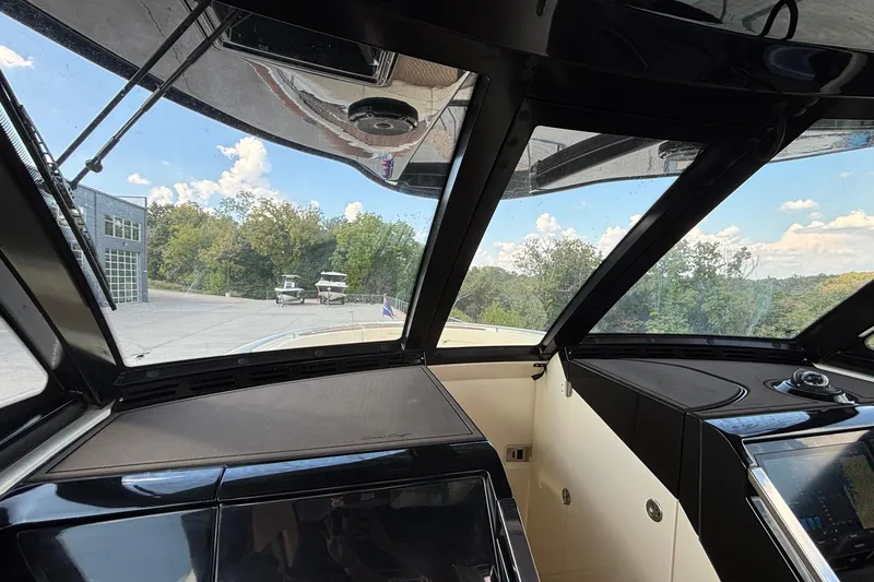 Slide: The Image of Interior view of 2021 Chris-Craft Calypso 35 boat cockpit with panoramic windows. - 62