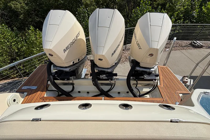 Slide: The Image of 2021 Chris-Craft Calypso 35 with triple Mercury outboard engines on teak deck. - 7