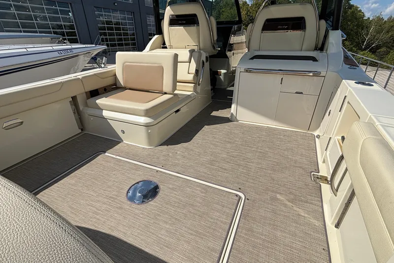 Slide: The Image of 2021 Chris-Craft Calypso 35 boat interior with beige seating and modern design. - 9