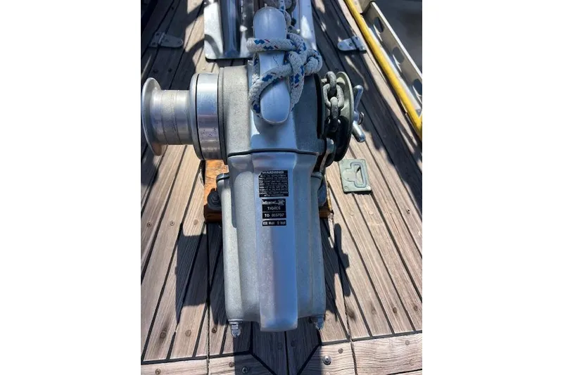 Slide: The Image of Anchor winch on 1987 Tayana Vancouver 42 sailboat deck, with coiled rope. - 11