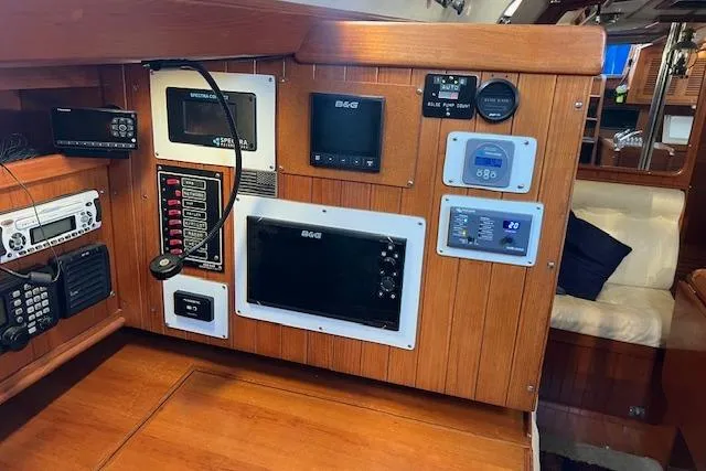 Slide: The Image of Control panel of 1987 Tayana Vancouver 42 yacht with navigation and communication equipment. - 17