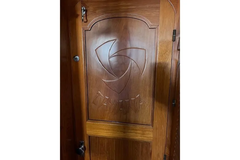 Slide: The Image of Wooden door with engraved design on a 1987 Tayana Vancouver 42 yacht. - 18