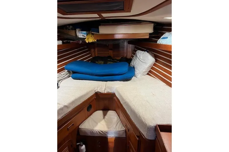 Slide: The Image of Interior cabin of 1987 Tayana Vancouver 42 sailboat with wooden finish and cushions. - 20