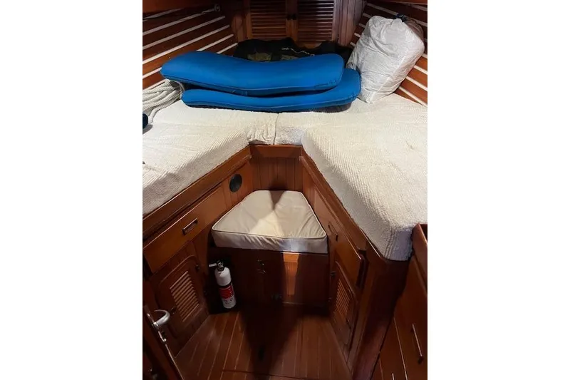 Slide: The Image of Cozy cabin interior of 1987 Tayana Vancouver 42 sailboat with wooden finish and bedding. - 22