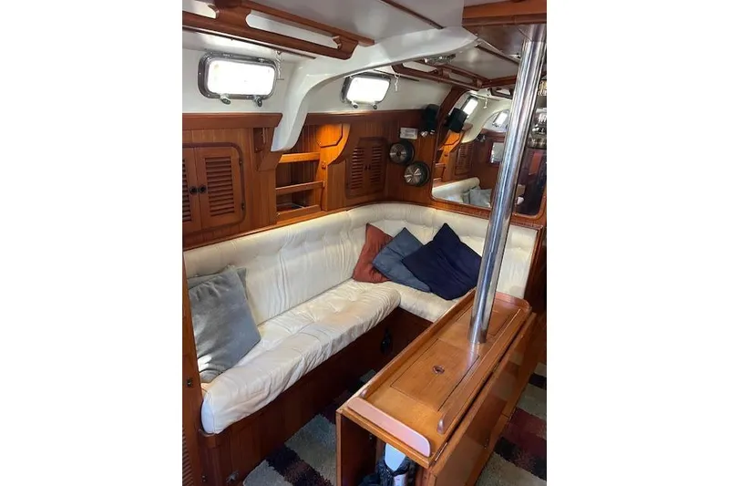 Slide: The Image of Interior of 1987 Tayana Vancouver 42 yacht with cozy seating and wooden finish. - 26
