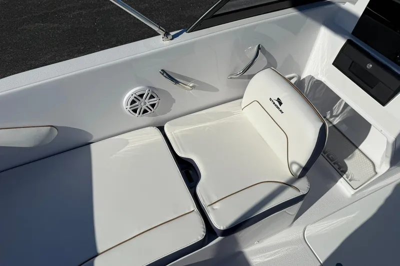 Slide: The Image of 2026 Stingray 172 DC boat interior with white seating and speaker. - 10