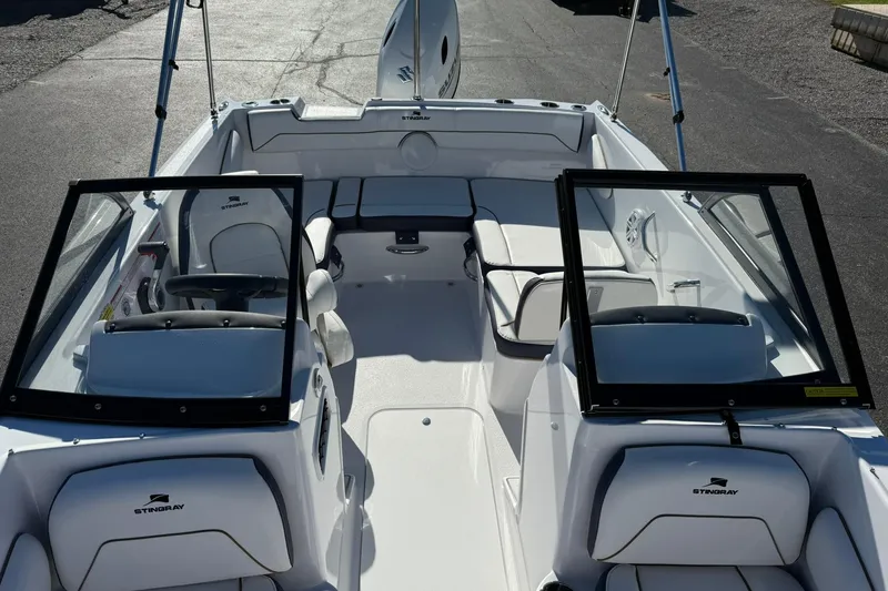 Slide: The Image of 2026 Stingray 172 DC boat interior with dual consoles and seating. - 16