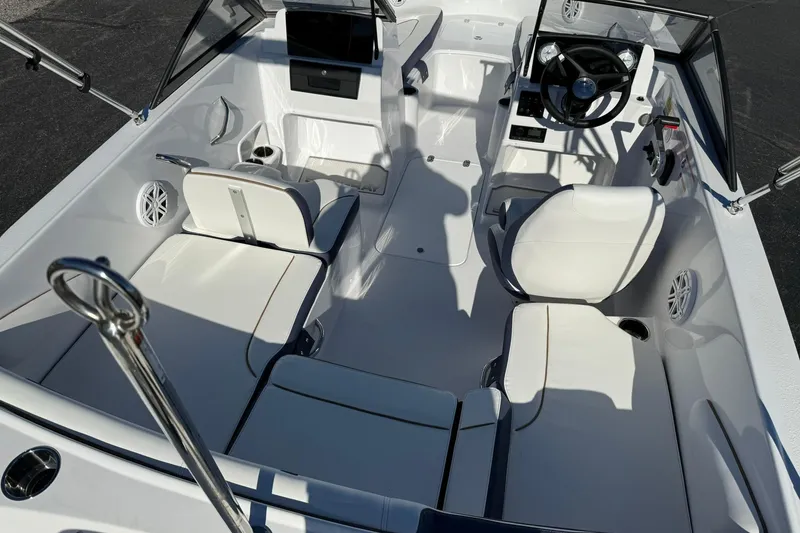 Slide: The Image of 2026 Stingray 172 DC boat interior with white seating and modern dashboard. - 7