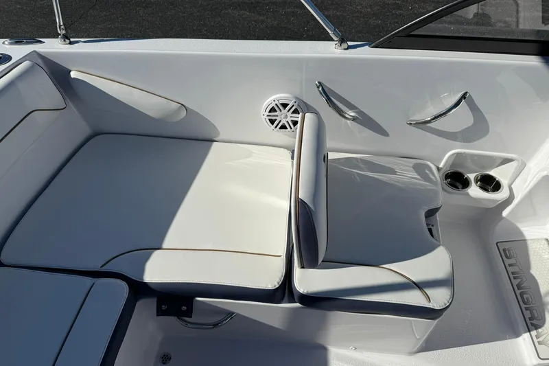 Slide: The Image of Interior seating of 2026 Stingray 172 DC boat with cup holders and speaker. - 9
