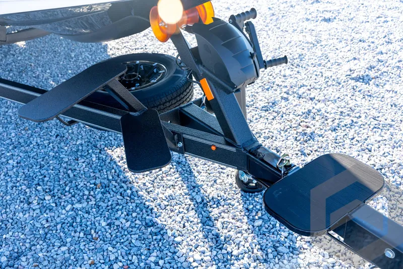 Slide: The Image of Trailer hitch of 2026 Skeeter ZXE21 on gravel surface. - 11