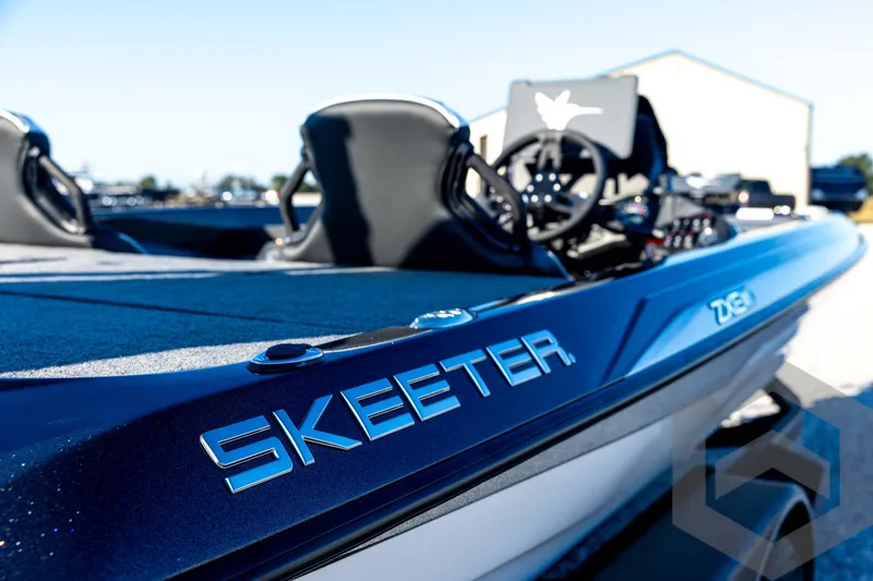 Slide: The Image of 2026 Skeeter ZXE21 boat, sleek design, close-up view of branding and interior. - 18