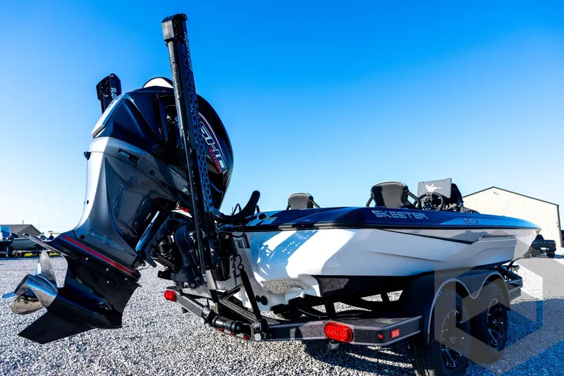 Slide: The Image of 2026 Skeeter ZXE21 boat with powerful outboard motor on a trailer. - 19