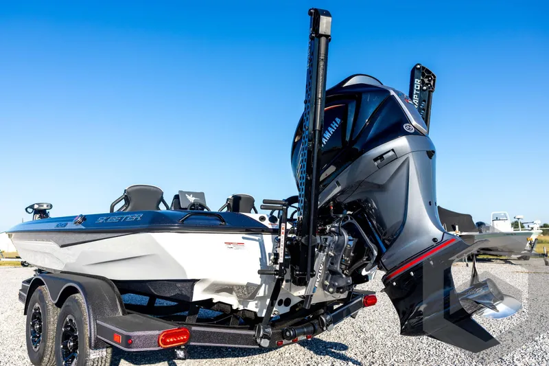 Slide: The Image of 2026 Skeeter ZXE21 boat with Yamaha engine on a trailer, under clear blue sky. - 26