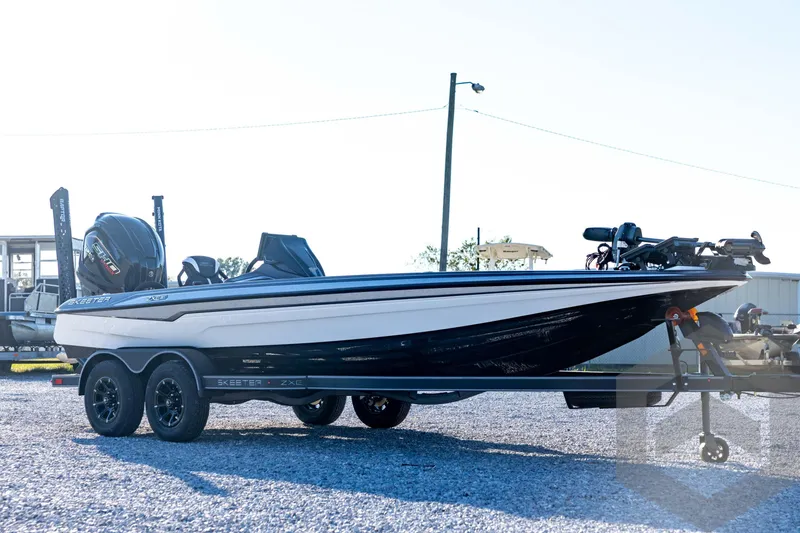Slide: The Image of 2026 Skeeter ZXE21 boat on trailer, sleek design, parked outdoors. - 3