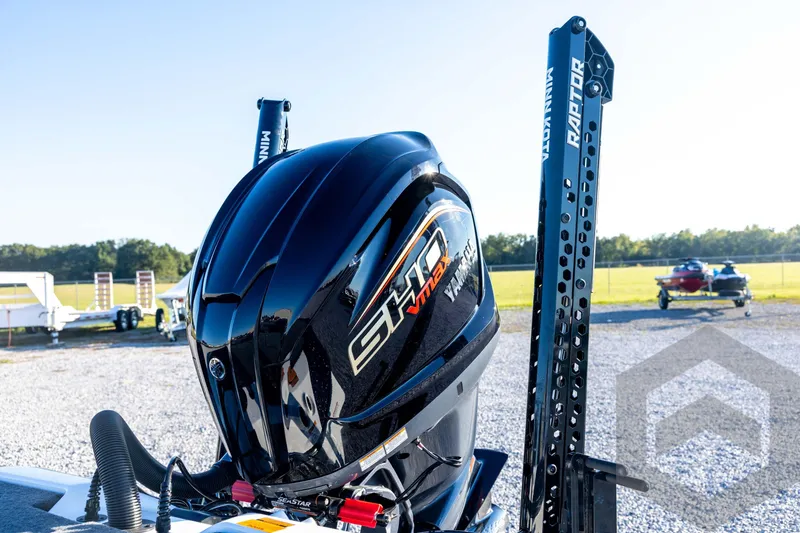 Slide: The Image of 2026 Skeeter ZXE21 boat with powerful outboard motor in a sunny outdoor setting. - 32