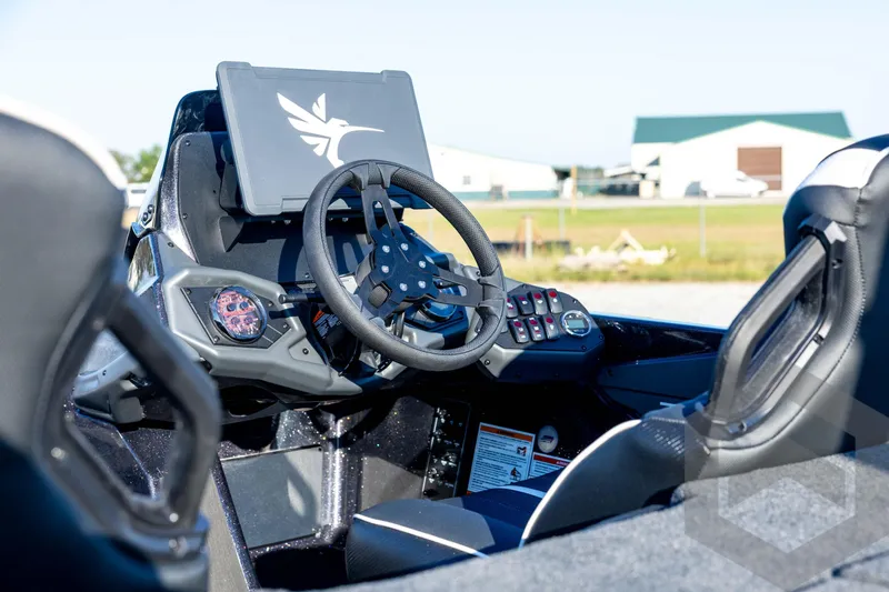 Slide: The Image of 2026 Skeeter ZXE21 boat cockpit with modern steering and control panel. - 43