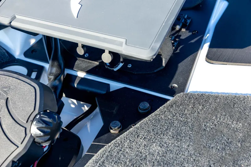 Slide: The Image of Interior view of 2026 Skeeter ZXE21 boat, showcasing control panel and carpeted flooring. - 49